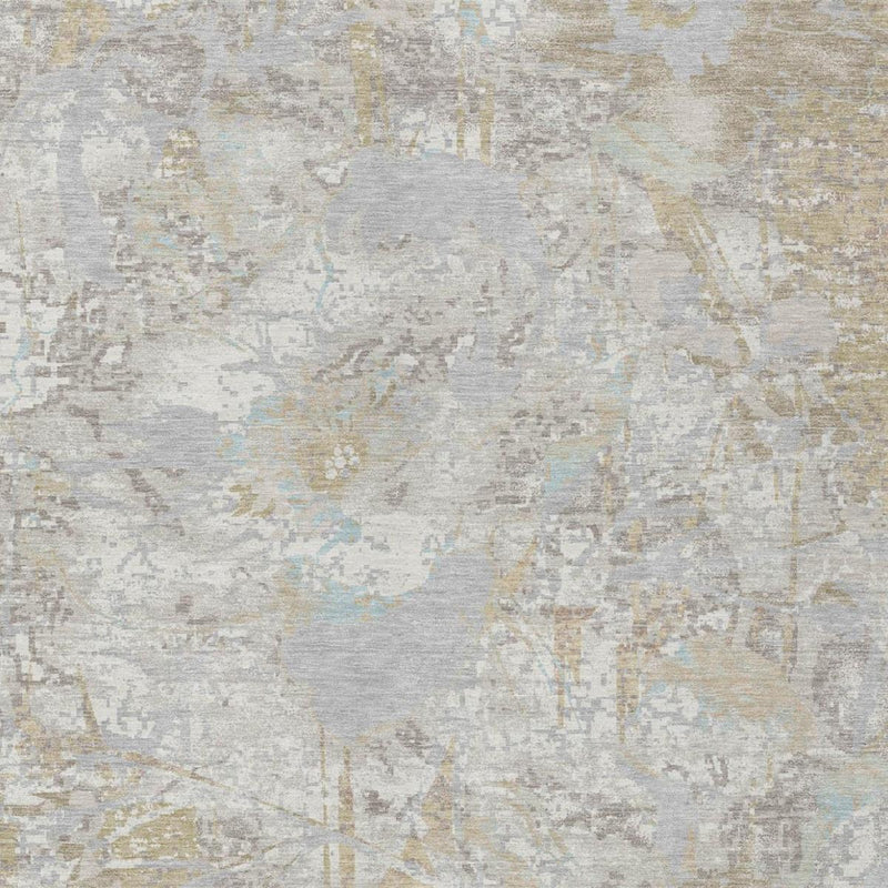 Close-up of ivory and silver area rug texture with abstract floral pattern.