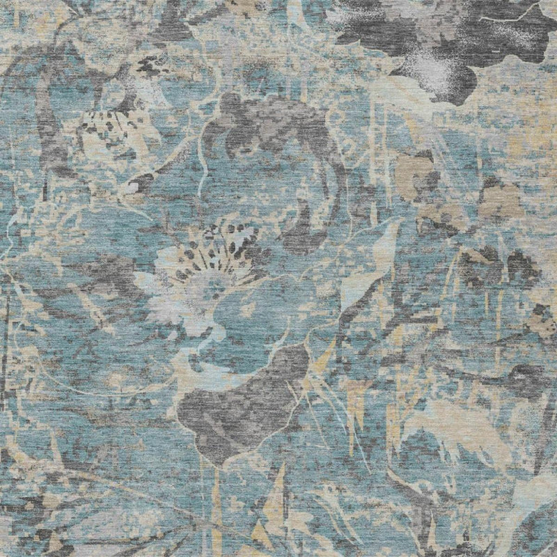 Teal blue and gray floral abstract area rug close-up with silver highlights