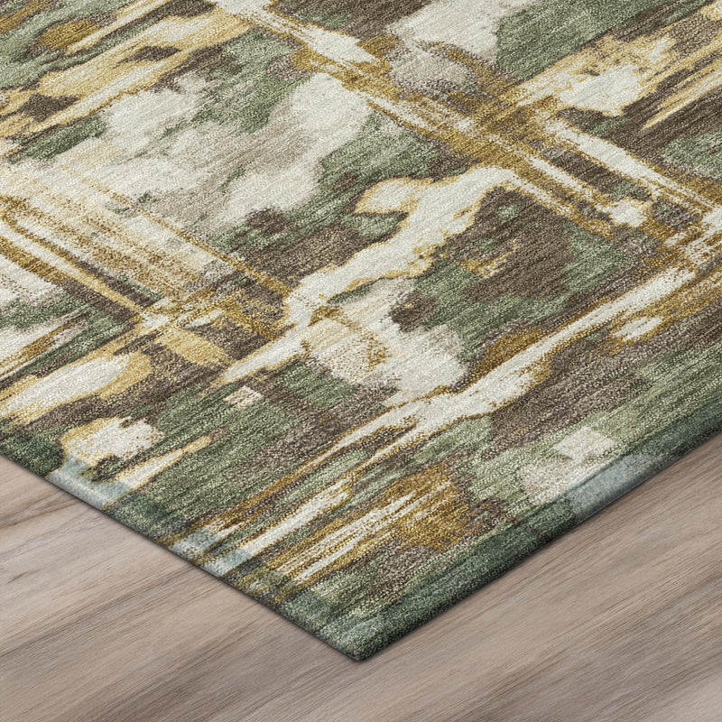 Green and cream abstract area rug corner with distressed lines and mottled texture.