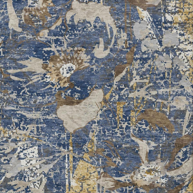 Close-up of blue and beige abstract area rug with distressed floral blocks