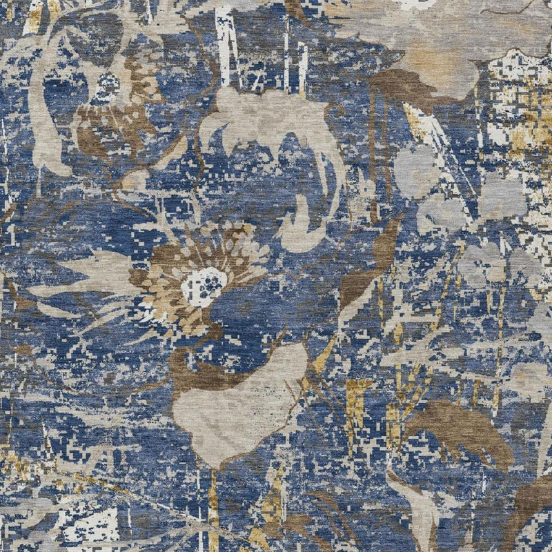 Close-up of blue and beige abstract area rug with weathered pattern details