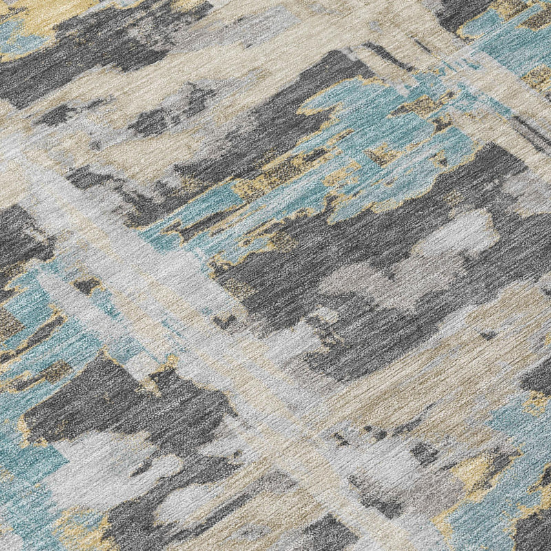Close-up of round abstract rug with gray, tan, and light blue distressed blocks