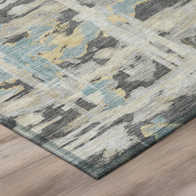 Corner view of round abstract rug with gray, pale blue, and beige distressed stripes