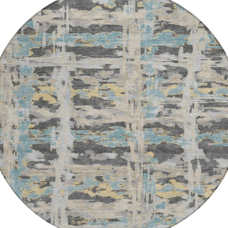 Center view of round abstract area rug with gray, cream, and pale blue textured blocks