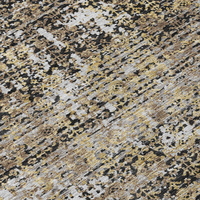 Close-up of round abstract rug with black, gray, and cream dotted texture