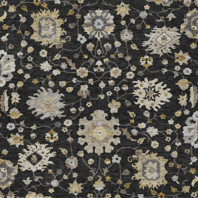 Black and graphite floral washable rug with scattered blossoms and decorative center motifs