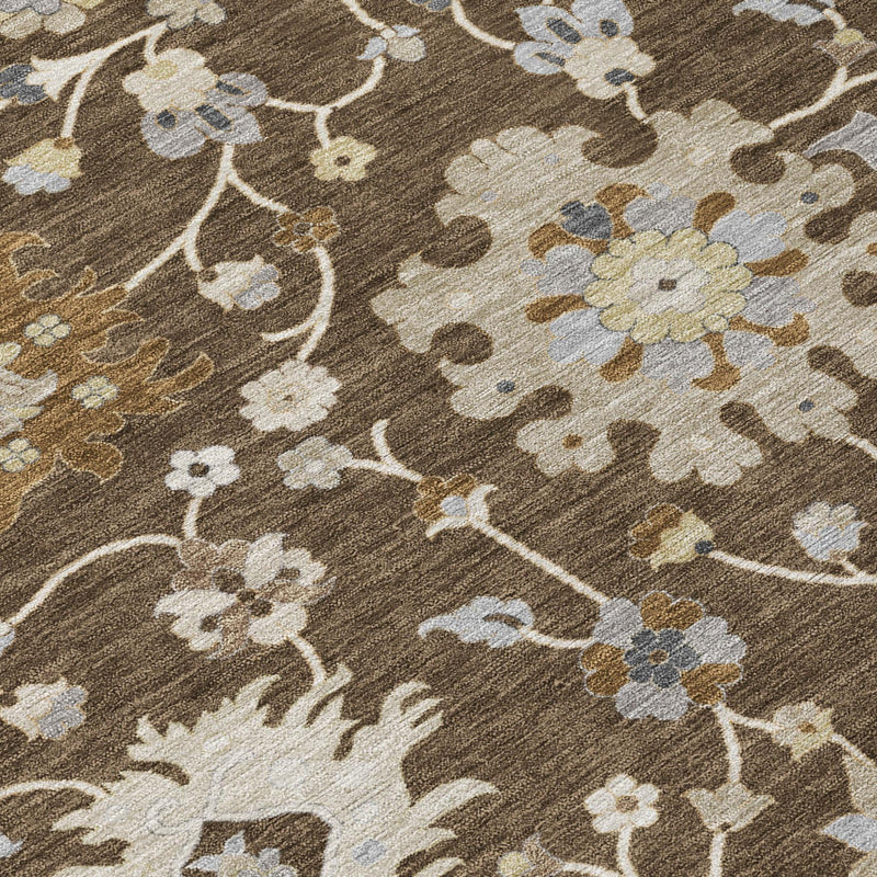 Floral area rug detail: dark brown pile with cream flowers and subtle light blue highlights