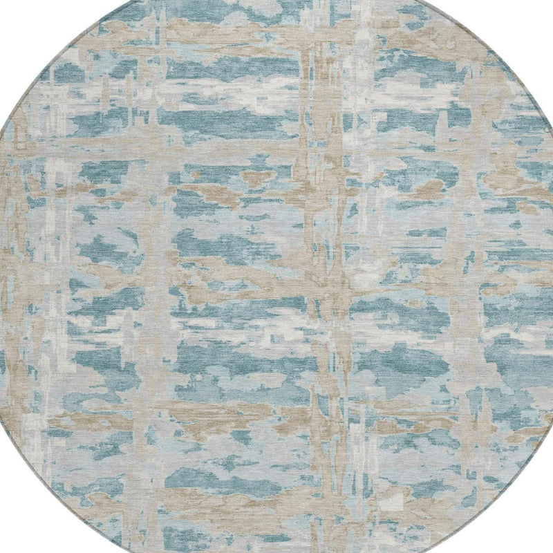 Round abstract area rug with light blue and beige block pattern and vertical center motif
