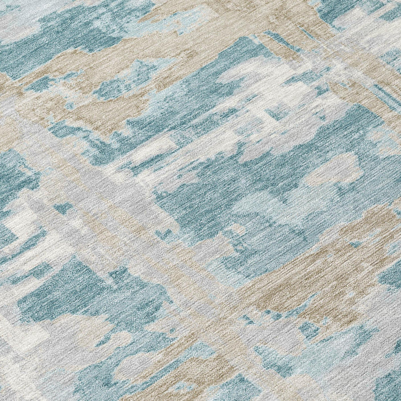 Close-up of round rug texture with light blue and beige distressed brushstroke blocks