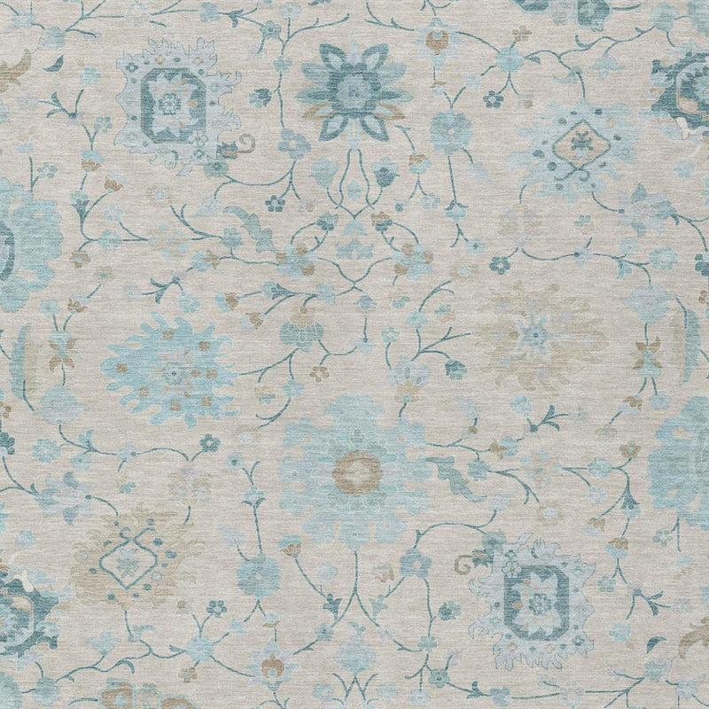 Light blue and ivory floral area rug with distressed vines and ornamental motifs