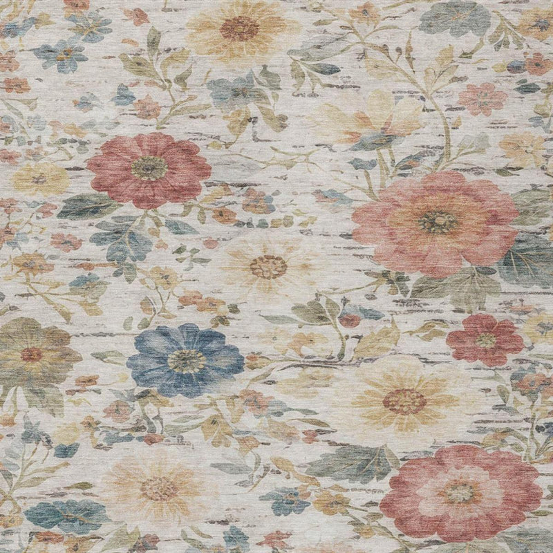 Ivory floral area rug with pink blossoms and blue accents; all-over botanical print