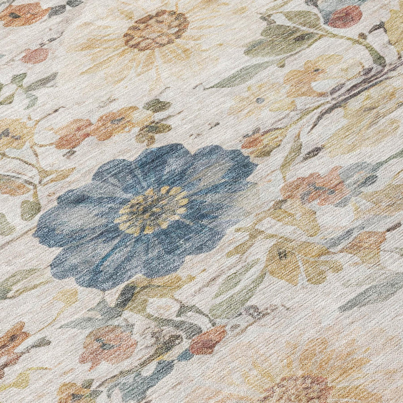 Ivory floral area rug with a bold blue flower and soft multicolor leaf pattern