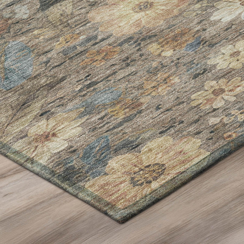 Corner view of rectangular floral area rug with textured, low-pile look in blue and khaki