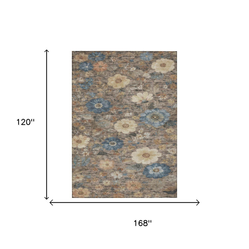 Rectangular floral area rug with khaki, brown, and blue distressed pattern.