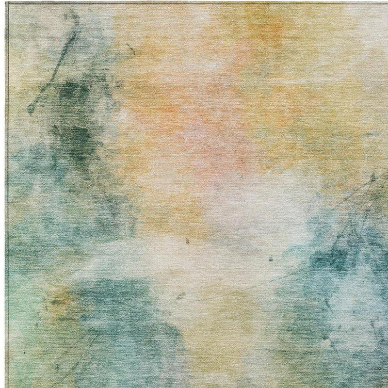 Abstract area rug close-up showing teal and peach wash textures on cream background
