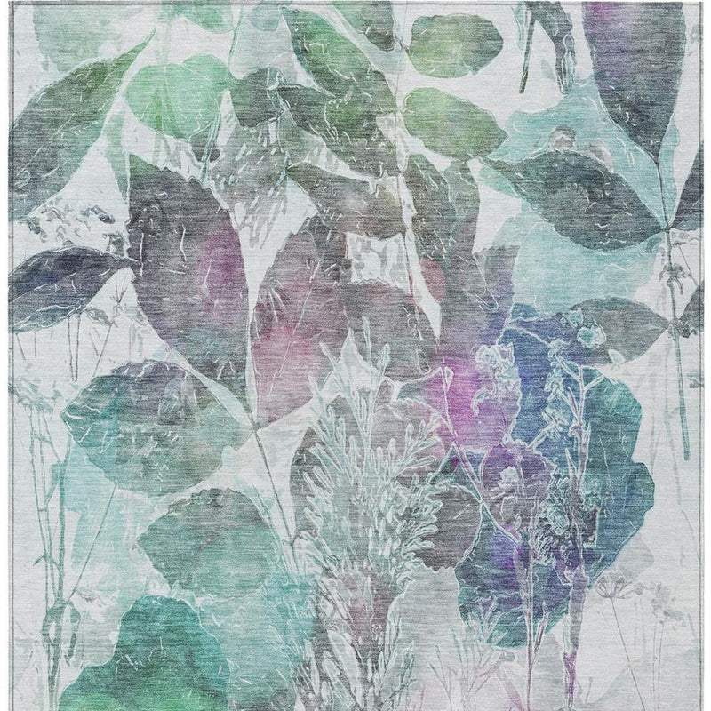Teal, green, and purple botanical leaf area rug with abstract watercolor plant silhouettes