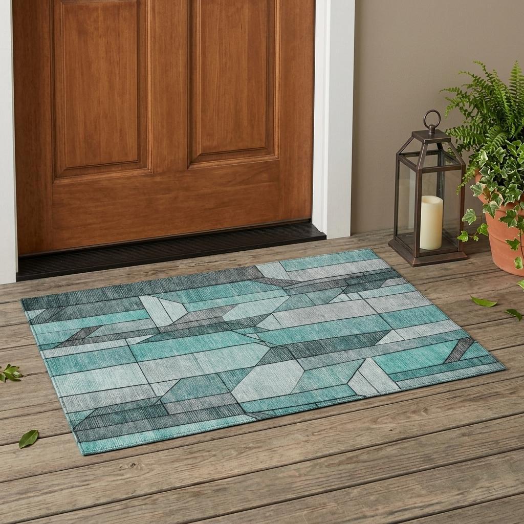 Geometric washable area rug with aqua and teal cube pattern and dark gray outline