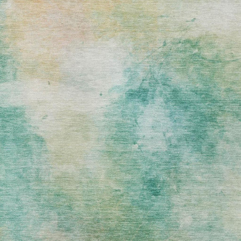 Close-up of abstract aqua, teal, and beige rug texture with soft, washed areas.