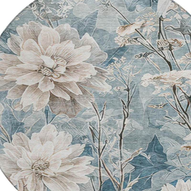 Close-up of round rug with cream flowers and teal blue branch pattern