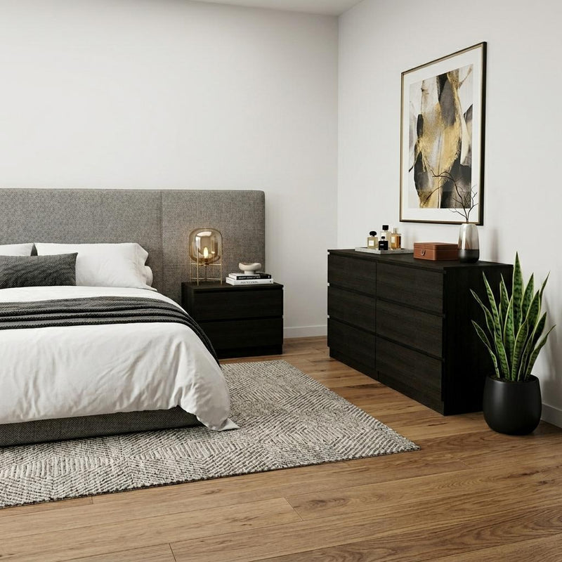 Black bedroom furniture set with bed, matching dresser, and nightstand