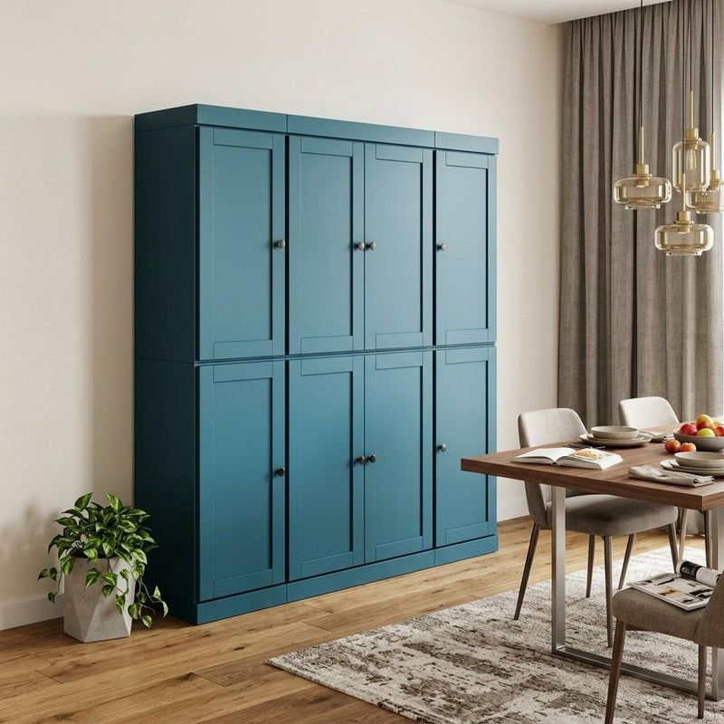 Teal blue pantry storage cabinet with black knob doors and smooth square panels