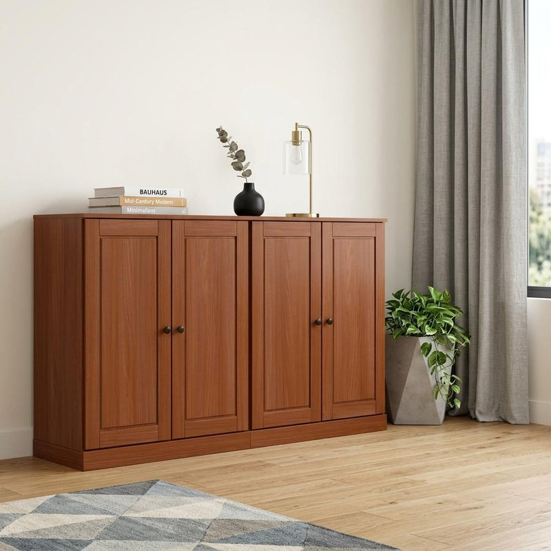 Brown solid wood sideboard with paneled doors and round black knobs