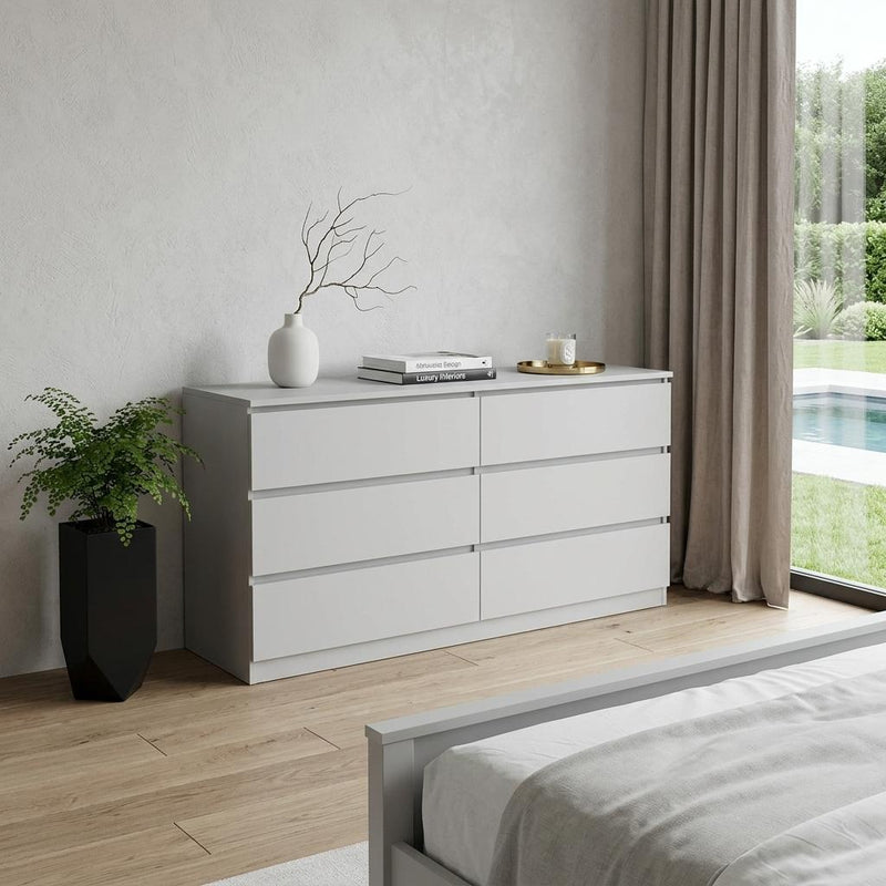 White six-drawer double dresser with wide top surface and stacked drawer fronts