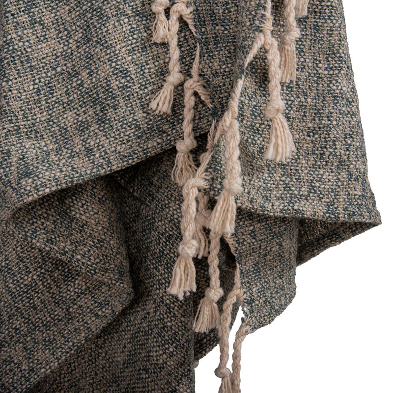 Teal woven throw blanket edge with long cream tassel fringe detail