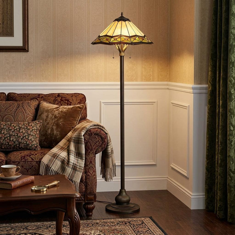 Bronze floor lamp with Tiffany-style stained glass shade and warm-toned glass panels