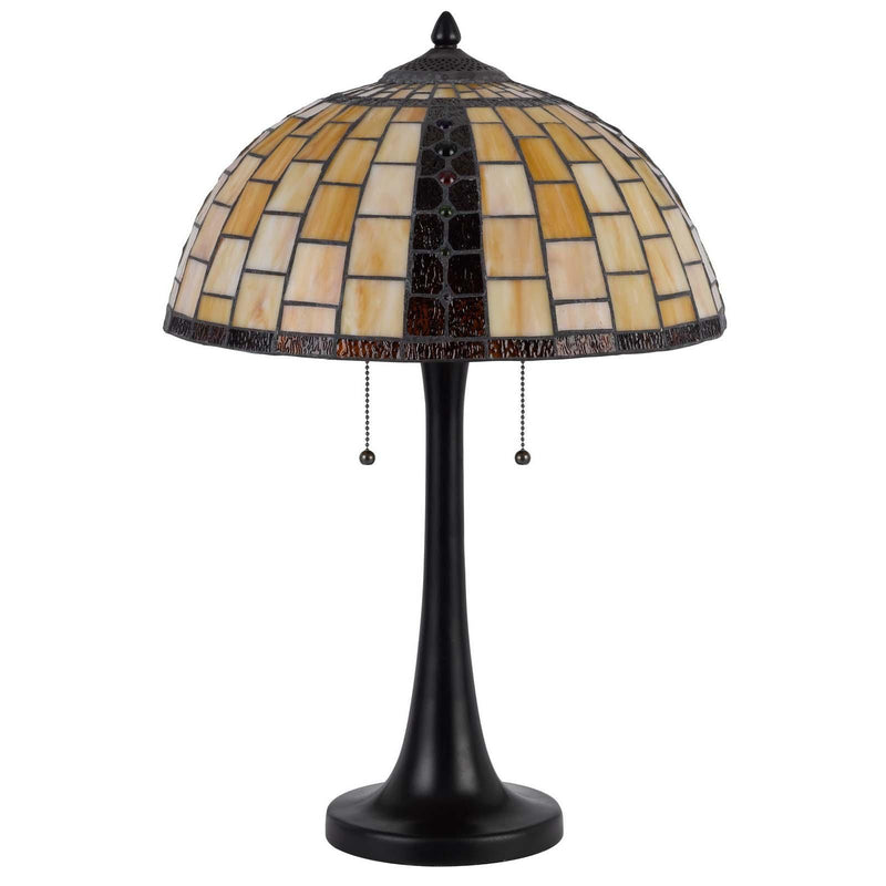 Round stained-glass dome table lamp shade with amber, white, and red mosaic over dark base