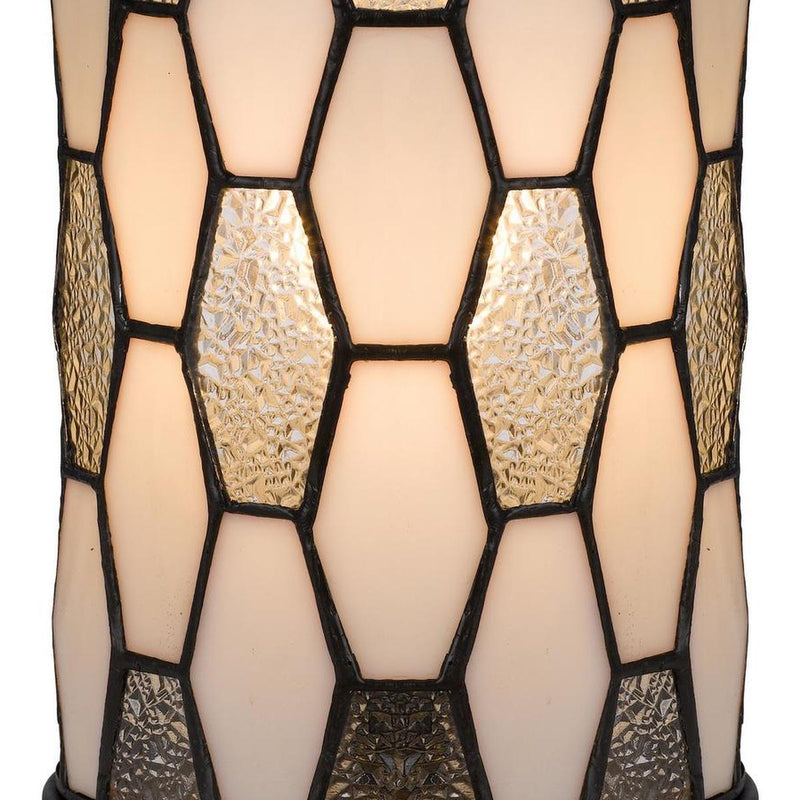 Bronze abstract stained-glass lamp shade close-up with geometric panels and dark trim