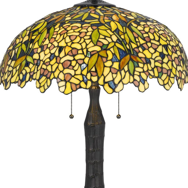 Tiffany-style table lamp with yellow-green stained glass dome shade and bronze base