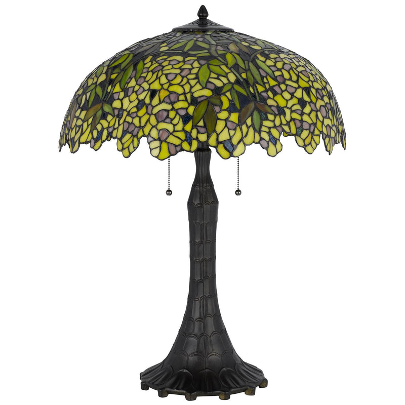 Table lamp with yellow-green stained glass dome shade and dark bronze pedestal base