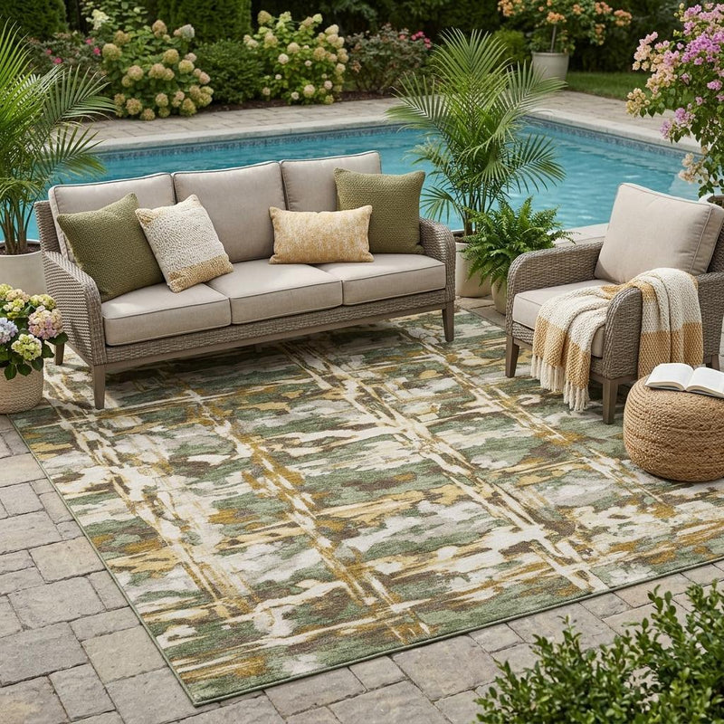 Olive green and beige abstract area rug under outdoor seating on patio