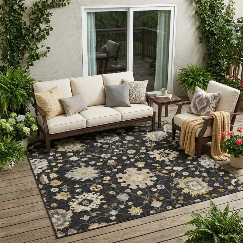 Black floral indoor outdoor area rug with gold, cream, and gray medallions