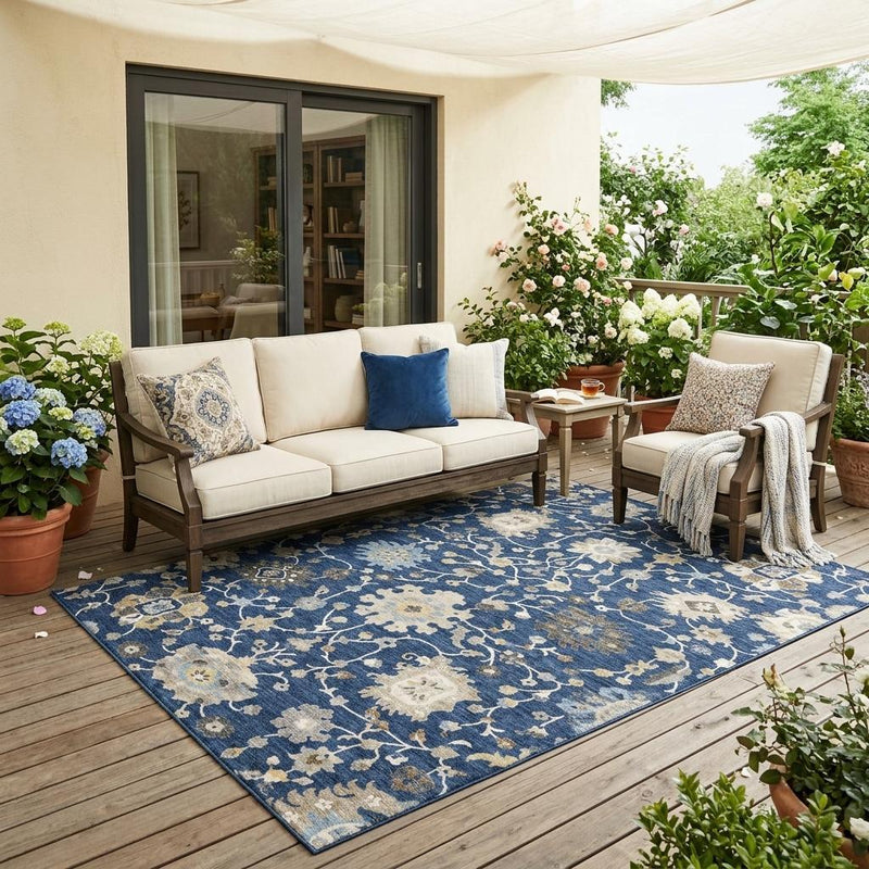 Indoor/outdoor navy blue floral area rug with beige and white flower vines