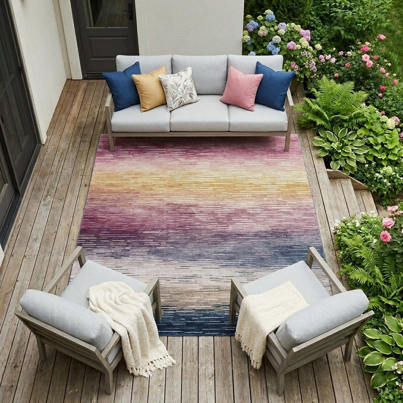 Washable striped area rug in blush, purple, and blue with faded horizontal lines
