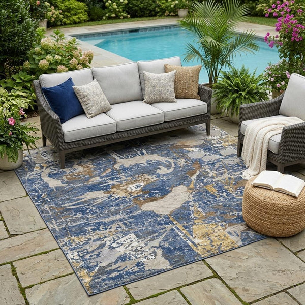 Navy blue and beige abstract area rug with distressed floral wash pattern