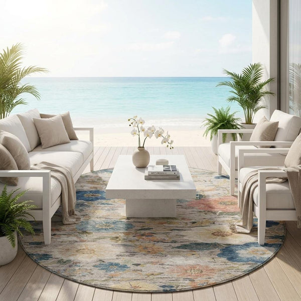 Round floral area rug with ivory base and blue, peach, and rust flowers