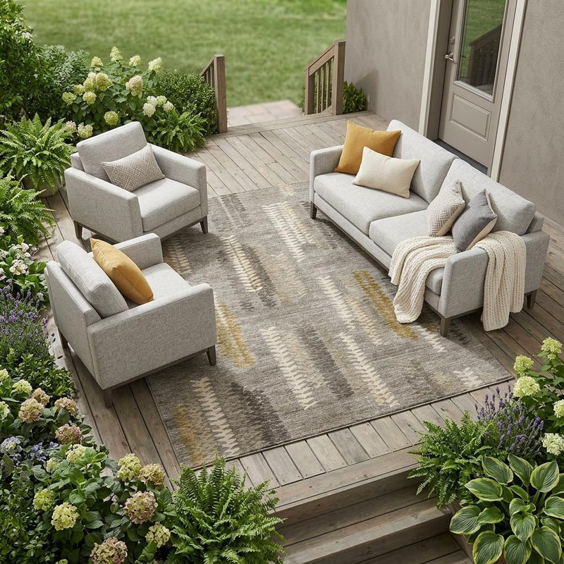 Indoor/outdoor abstract area rug with gray and pewter stripes and gold accents