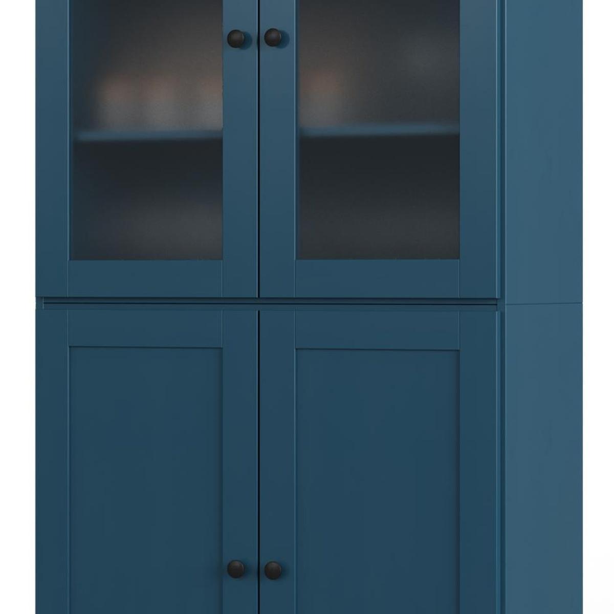 Teal blue pantry cabinet front with two glass doors and two solid doors, round knobs