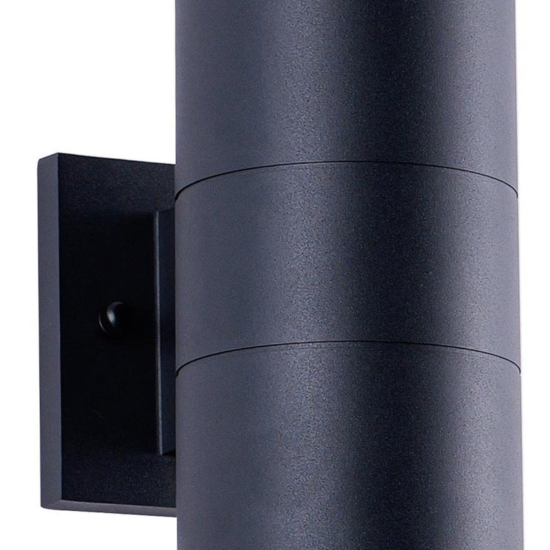Black outdoor wall light close-up: cylindrical shade with dark square mounting backplate
