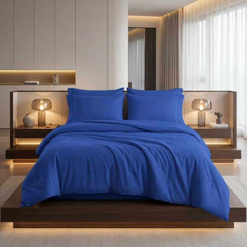 Blue king duvet cover set with two shams, bed made with matching covers