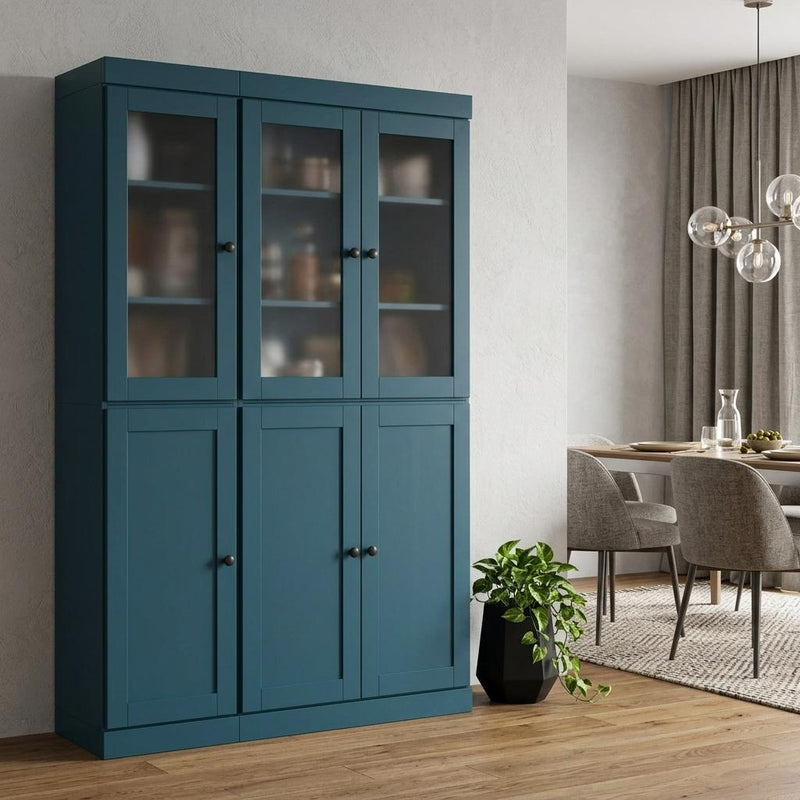 Teal blue wooden pantry cabinet with triple glass doors above and triple panel doors below
