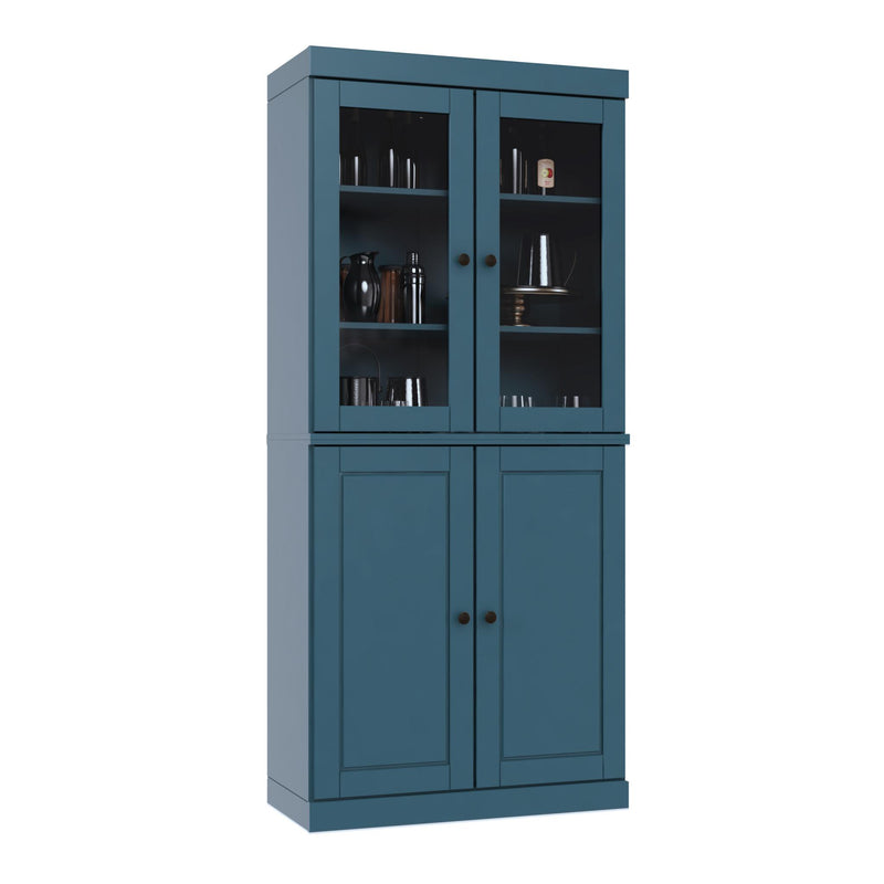 Teal blue wood pantry cabinet with two glass doors above two panel doors