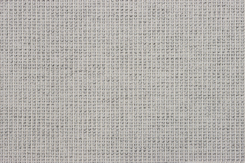 Gray woven area rug surface close-up with tight grid pattern