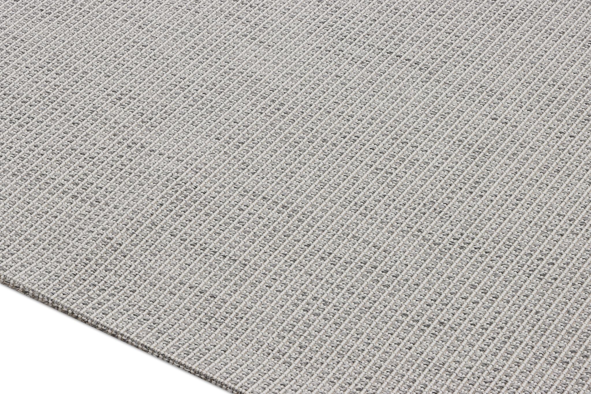 Gray textured area rug surface with tight interwoven pattern