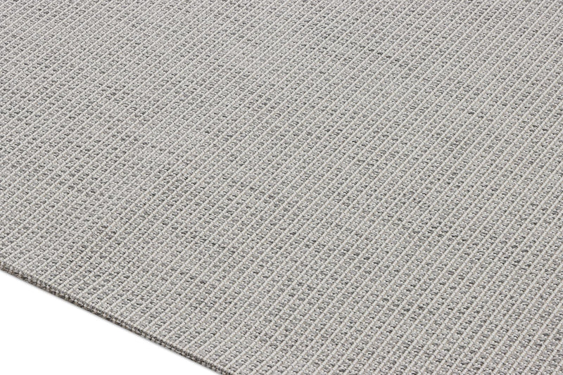 Gray textured area rug surface with tight interwoven pattern