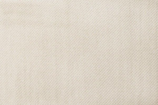 Beige woven area rug close-up, dense loop weave texture