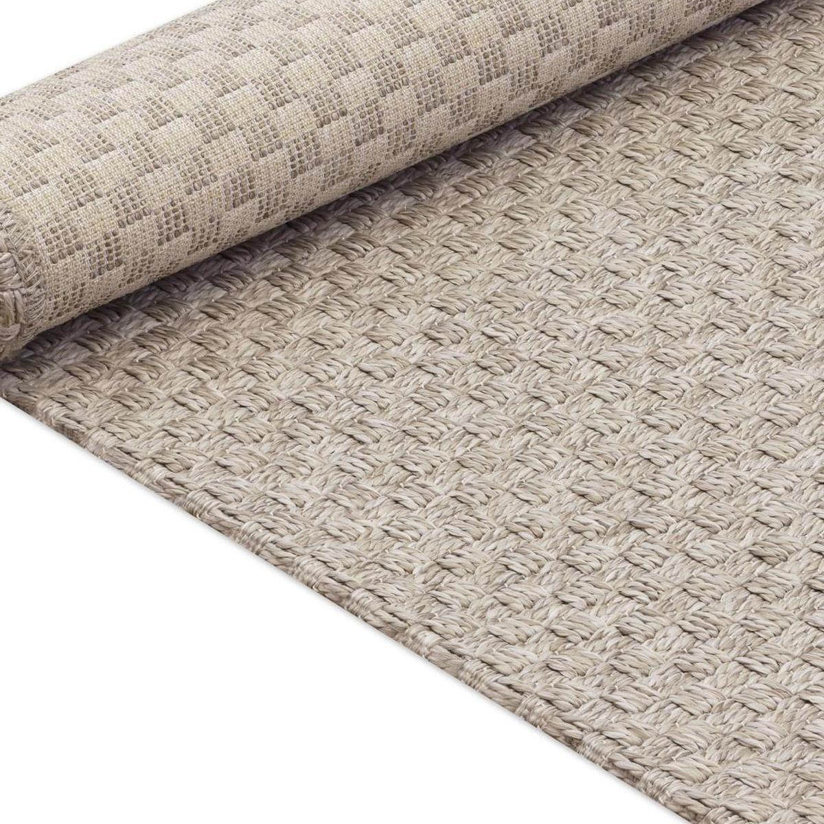 Beige woven area rug with bound border and textured, looped finish